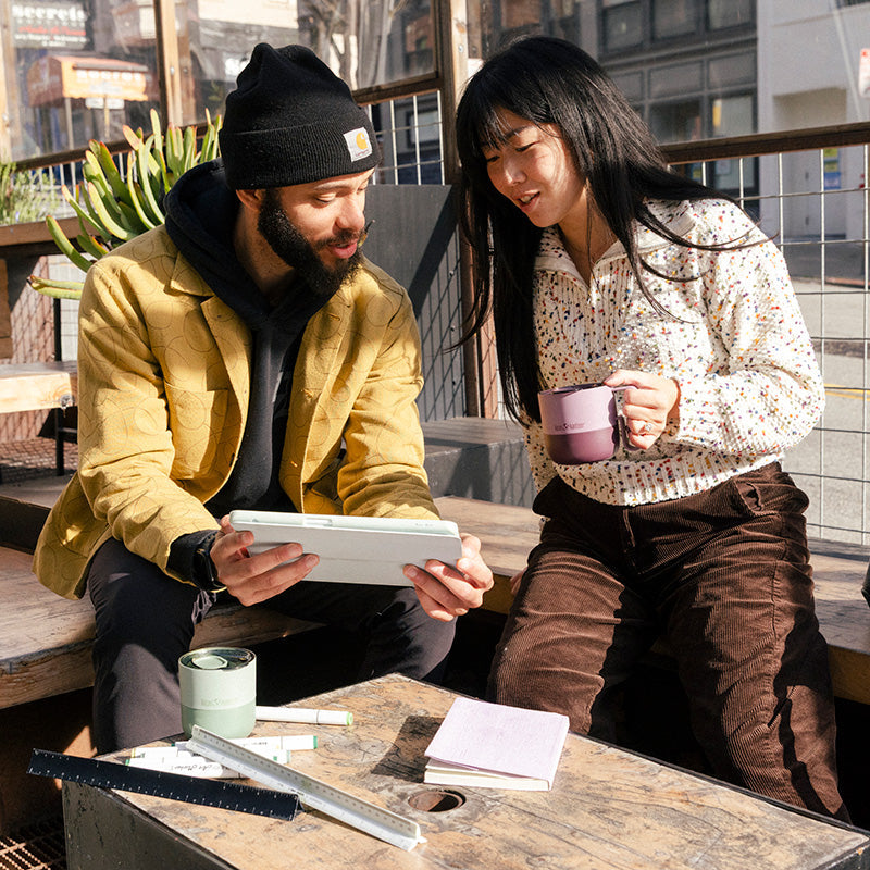 12oz-rise-mug-s8 12oz_rise_coffee_mug_dusty_orchid_couple_city_patio_square.jpg