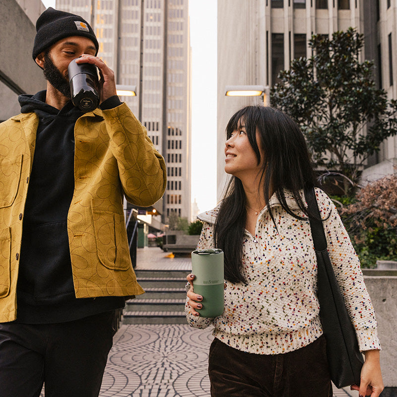 16oz-rise-tumbler-k6 16oz_rise_tumbler_black_iceberg_couple_drink_city_street_square.jpg