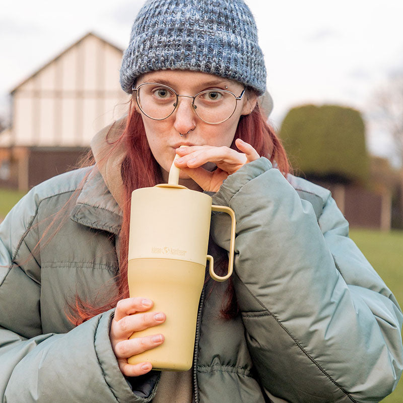 26oz-rise-tumbler-with-straw-lid-p3 26oz_rise_rumbler_straw_wax_yellow_woman_sip_square.jpg
