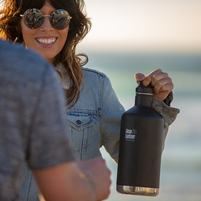 64oz-classic-with-loop-cap-u7 64oz_insulated_classic_black_beach_girl_hand_square.jpg