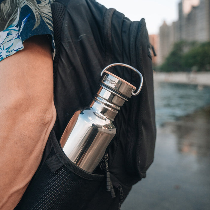 27oz-reflect-with-bamboo-cap-n9 K27SSLRF-MS-BAMBOO_reflect-bottle_backpack_lifestyle.jpg