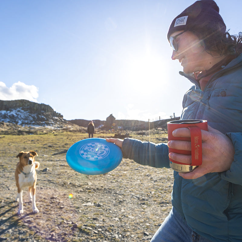 12oz-camp-mug-v8 insulated_camp_mug_12oz_woman_dog_frisbee_square.jpg